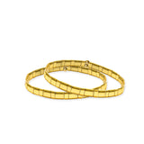 Stacking layered gold tila beaded bracelet elastic slides on and off easily.